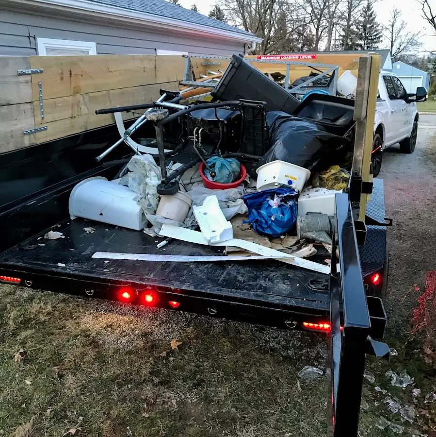 Roll-off dumpster delivered to a residential driveway in Sitka
